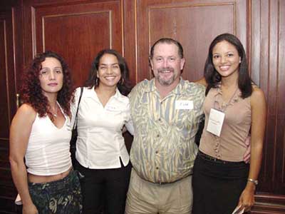 three beautiful Latin women with a client