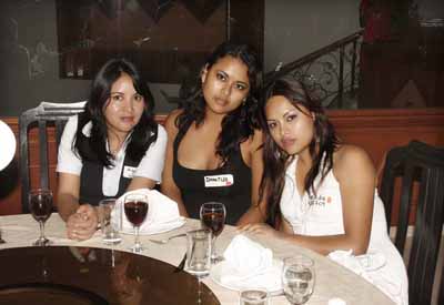 Latin women pose for the camera